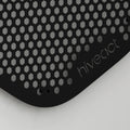 Close-up of Hiveact wall reaction board showing metal hex grid and magnetic mounting surface