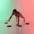 Woman performing a workout with Reaction Lights and black magnetic bases